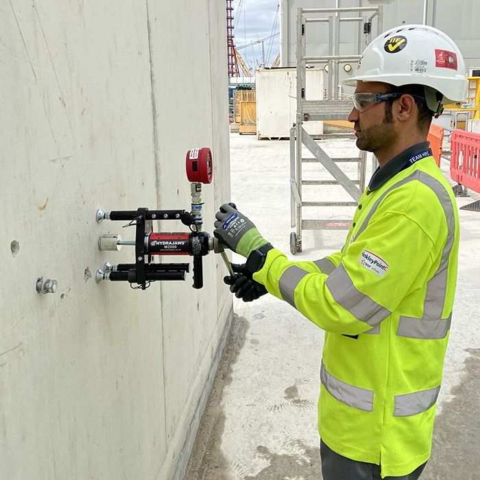 Testing mortar anchors on a natural stone facade in Berlin